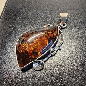 Elegant Amber Pendant with Silver Accents